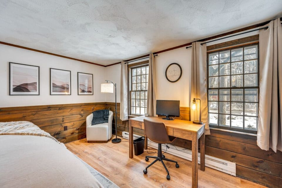 Wake up to natural light and mountain views in this inviting bedroom.