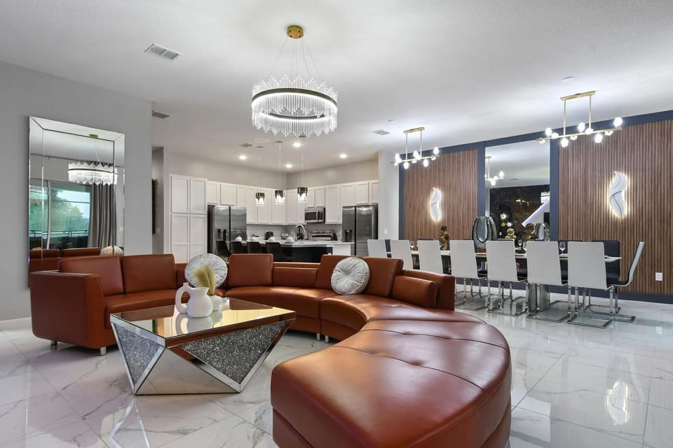 Seamless elegance: An expansive open-concept living, dining, and kitchen space designed for ultimate comfort and style