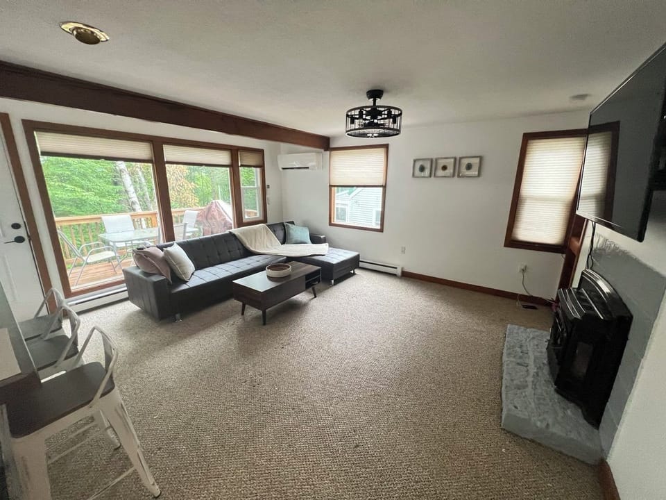Open-concept upper-level living room featuring two pull-out sofas,up to 2 guests