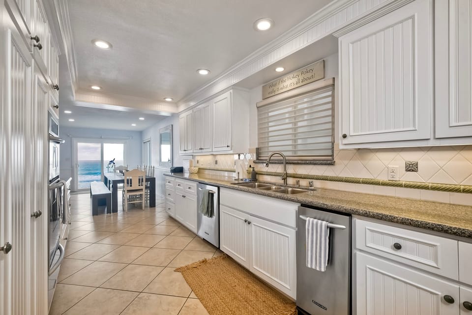 View from kitchen to dining area to ocean