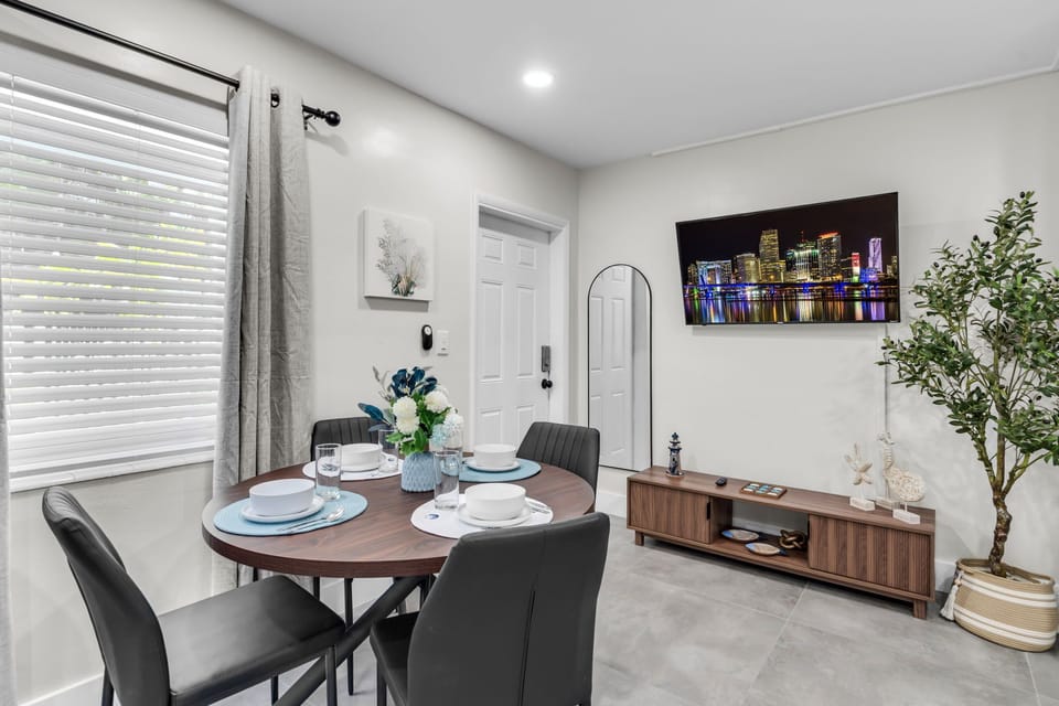 Enjoy meals at the dining table with seating for four, conveniently located between the kitchen and living room.