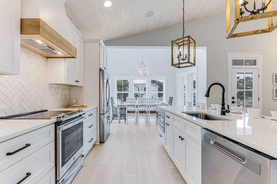 Our kitchen with Stainless Steel Appliances, Induction Stove, and Spacious Countertops for Easy Meal Preparation.