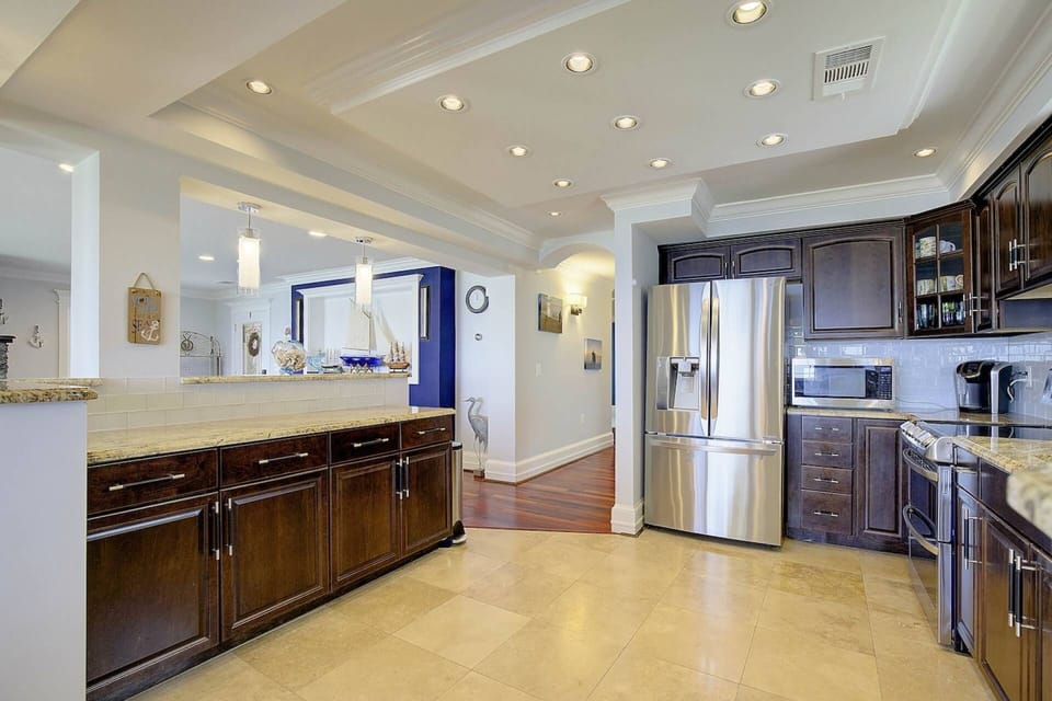 The kitchen is fully stocked with everything you need to cook and serve a family meal.