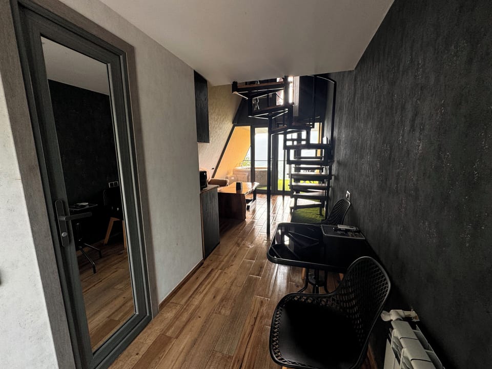 Comfort Room, Balcony, Mountain View | Living area | TV, heated floors