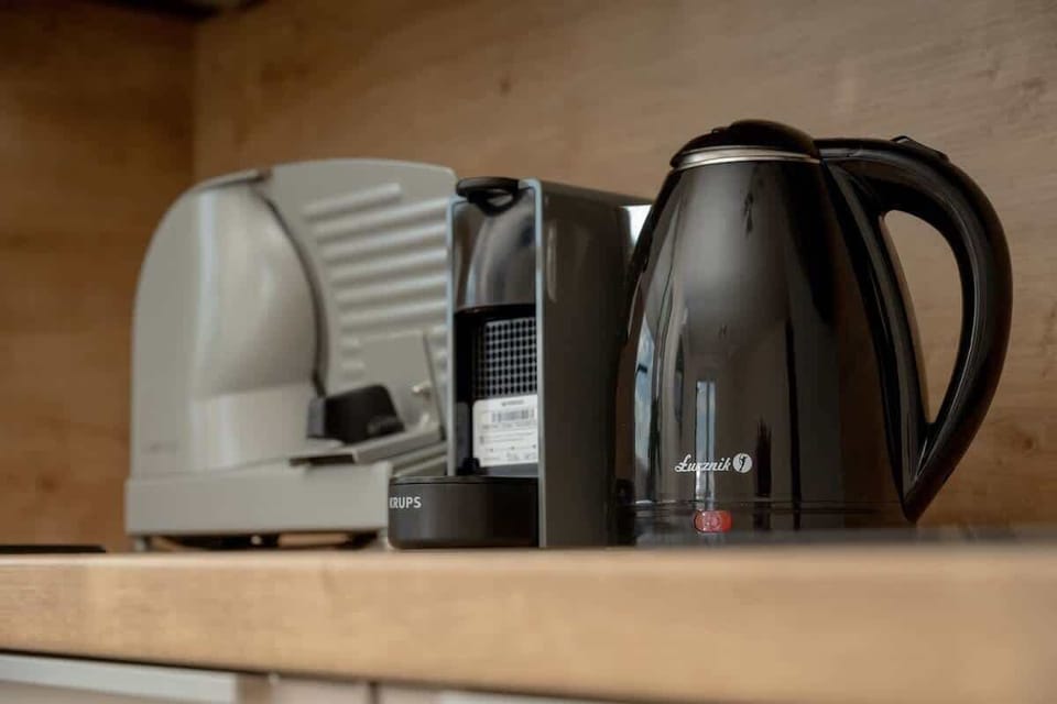 Electric kettle and coffee machine on the kitchen countertop.