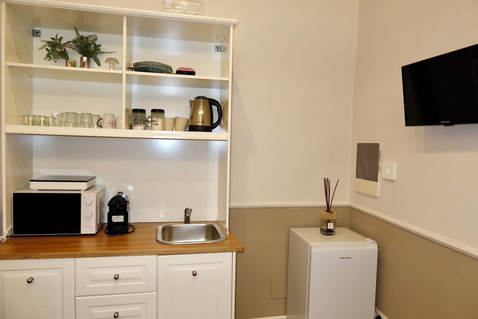 Family Quadruple Room | Private kitchen | Mini-fridge, electric kettle