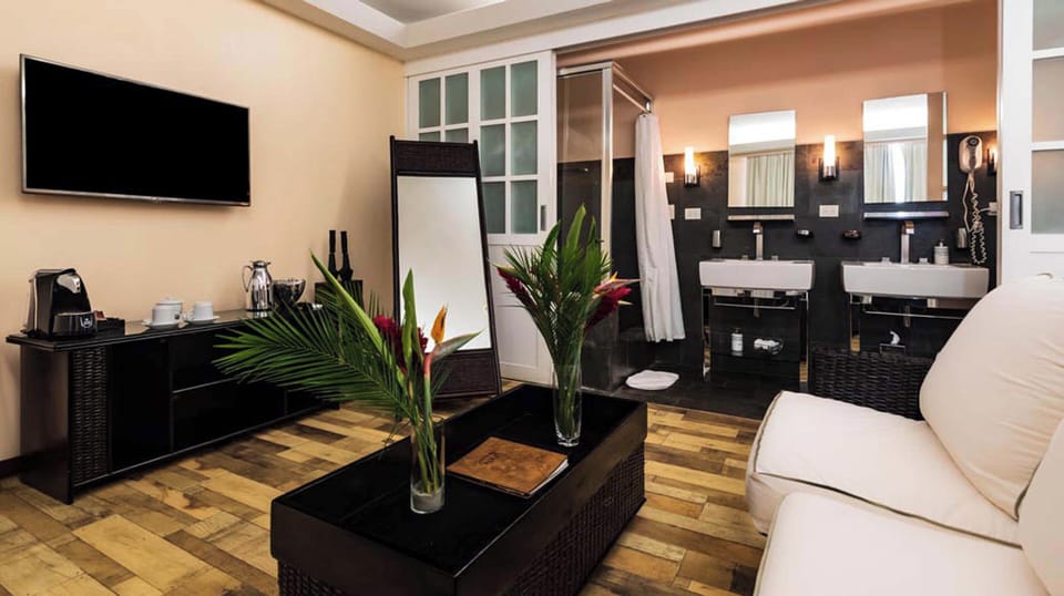 Studio, Garden View | Living area | 55-inch LCD TV with cable channels, DVD player, MP3 dock