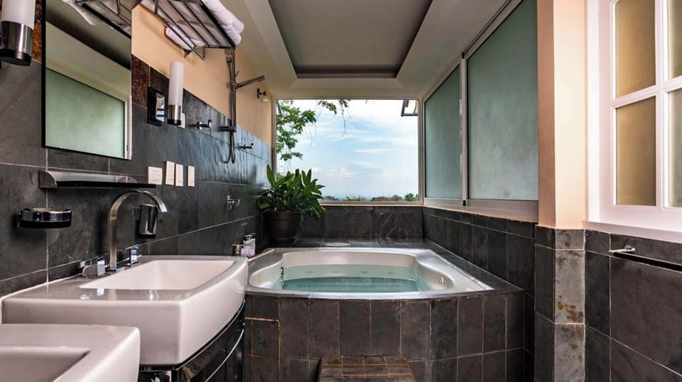 Villa | Bathroom | Combined shower/tub, designer toiletries, hair dryer, bathrobes