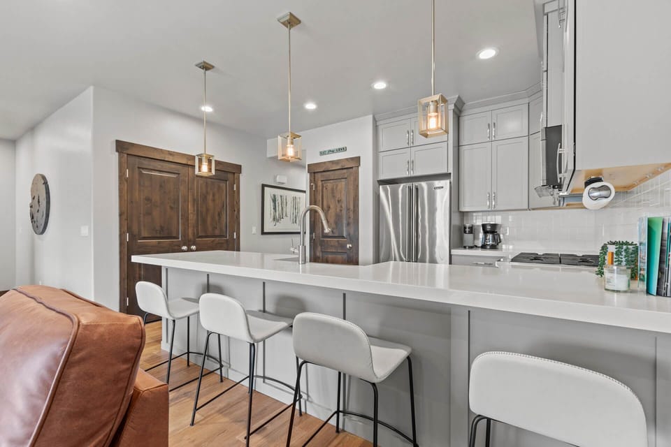 Gather at the sleek island for morning coffee or casual meals. Modern appliances and ample counter space make preparing your favorite dishes effortless and enjoyable.