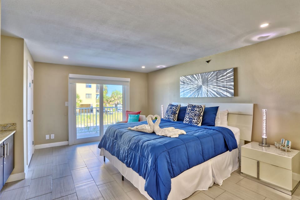 Master Bedroom with King Bed and Balcony Access