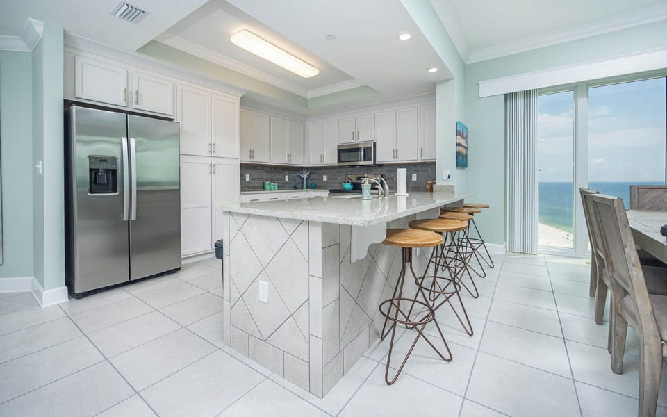 Sip your morning coffee at the breakfast bar and get ready for a beach day in this stylish space