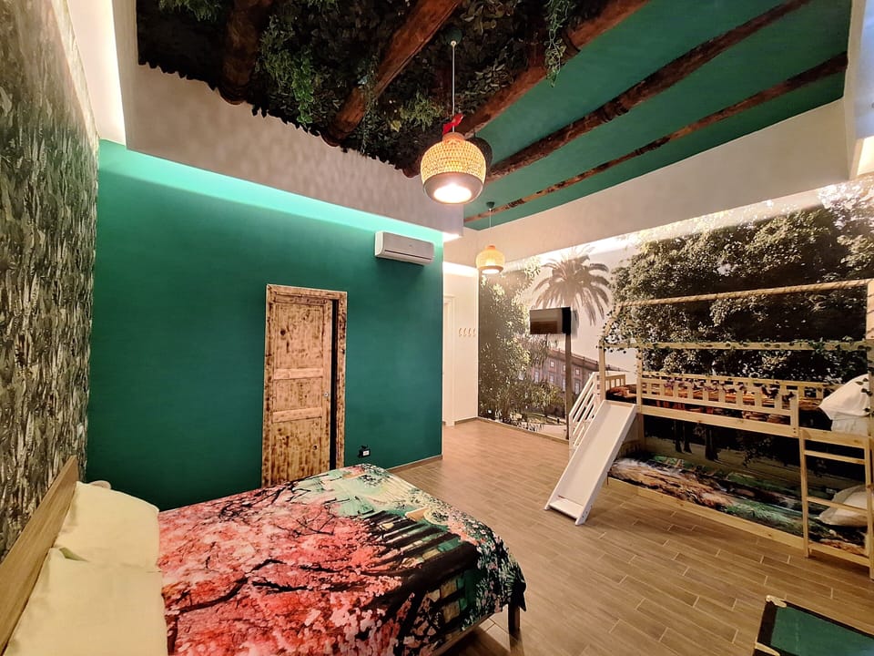 Deluxe Quadruple Room, Balcony, City View | Desk, laptop workspace, blackout drapes, free WiFi