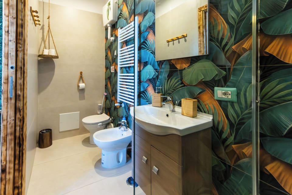Deluxe Quadruple Room, Balcony, City View | Bathroom | Free toiletries, hair dryer, towels, soap