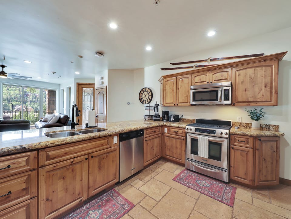 Gourmet Kitchen Complete with Kitchen Aid Appliances: Stove, Oven Microwave, Dishwasher, Double Door Refrigerator/Freezer