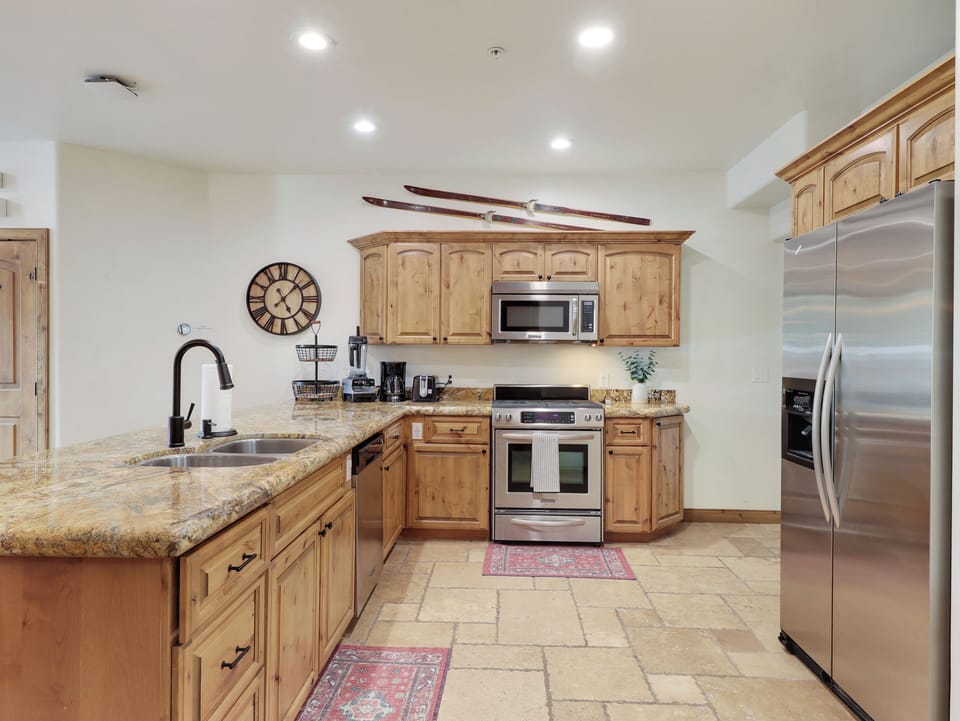 Gourmet Kitchen Complete with Kitchen Aid Appliances: Stove, Oven Microwave, Dishwasher, Double Door Refrigerator/Freezer