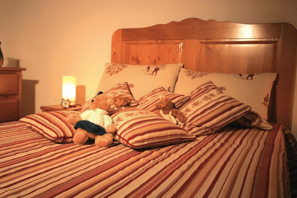 The master bedroom features a Double bed and the second bedroom contains a Bunk bed.