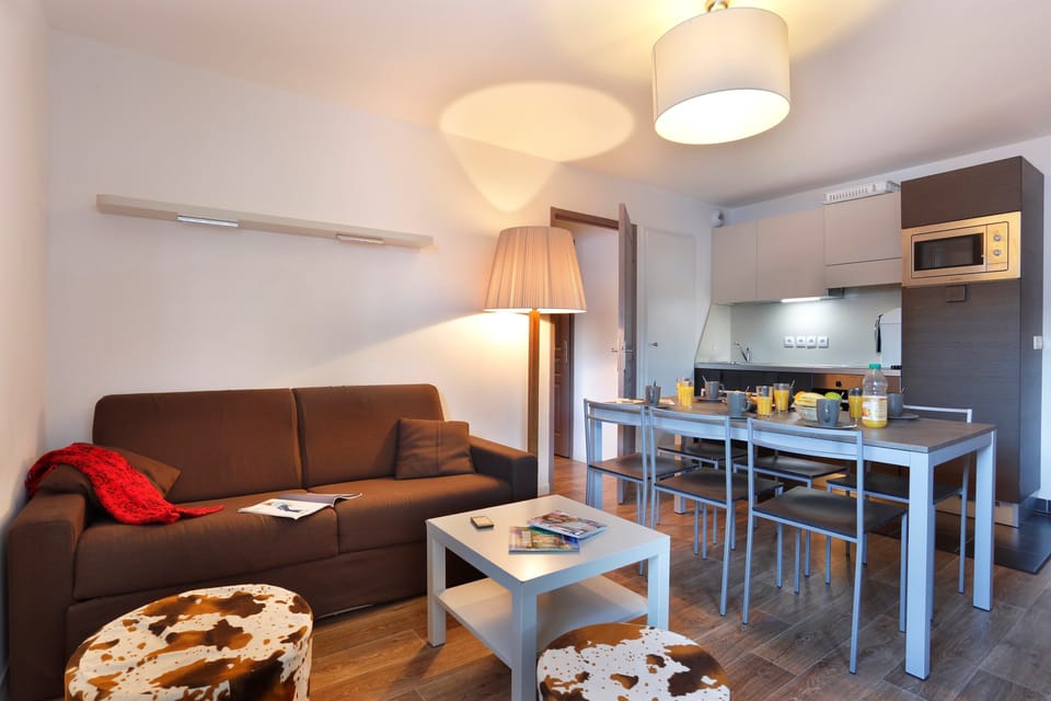 Prepare meals in the kitchenette and enjoy them at the dining table.
