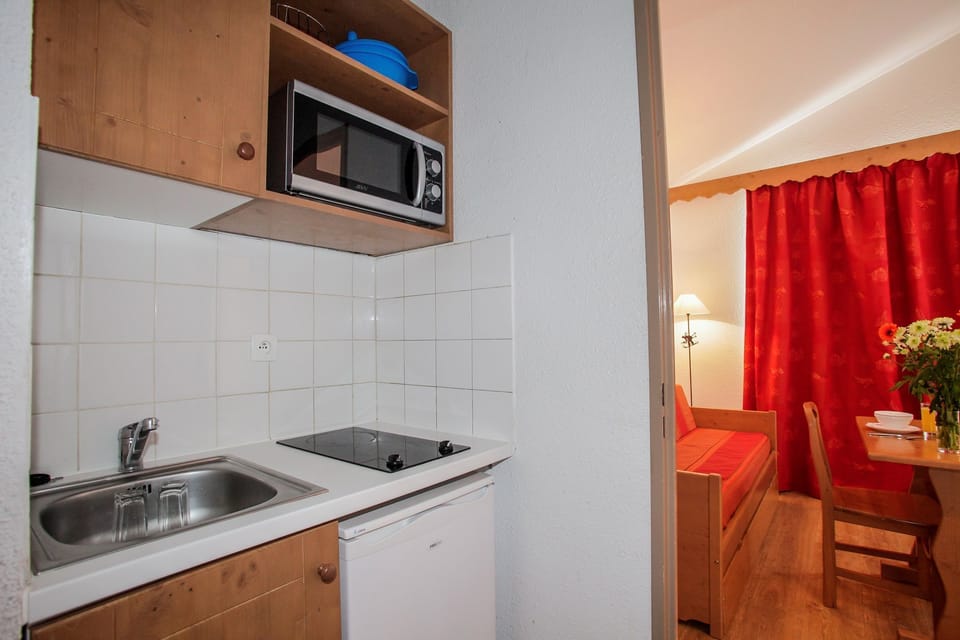 Prepare a meal in the equipped kitchen.