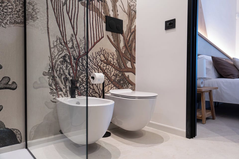 Deluxe Double Room, Balcony, Sea View | Bathroom | Shower, hair dryer, bidet, towels