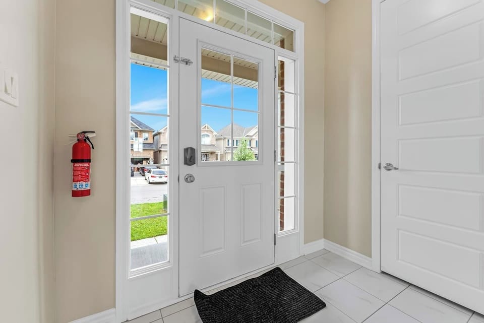Cozy living space with natural light, comfy seating, and serene outdoor views.
