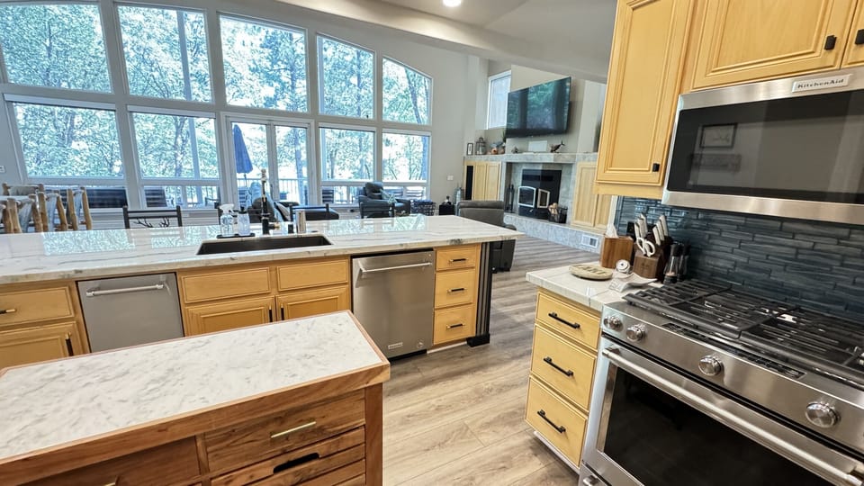 Kitchen looking out at family room and lake