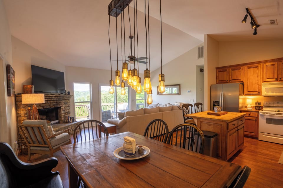 The dining room table seats 6  with 4 chairs and a bench 