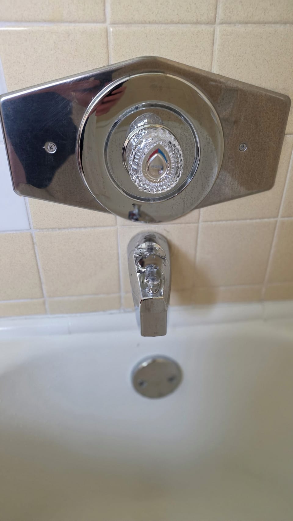 Pull the control out for shower;  turn left or right for hot or cold water