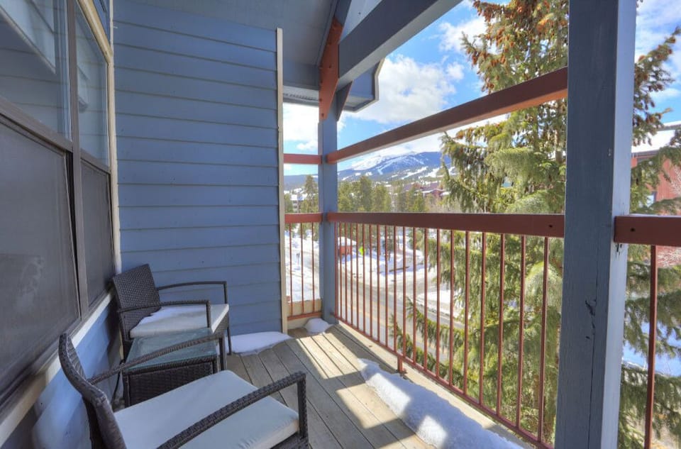 Private balcony with outdoor seating, perfect for enjoying mountain views and fresh air.