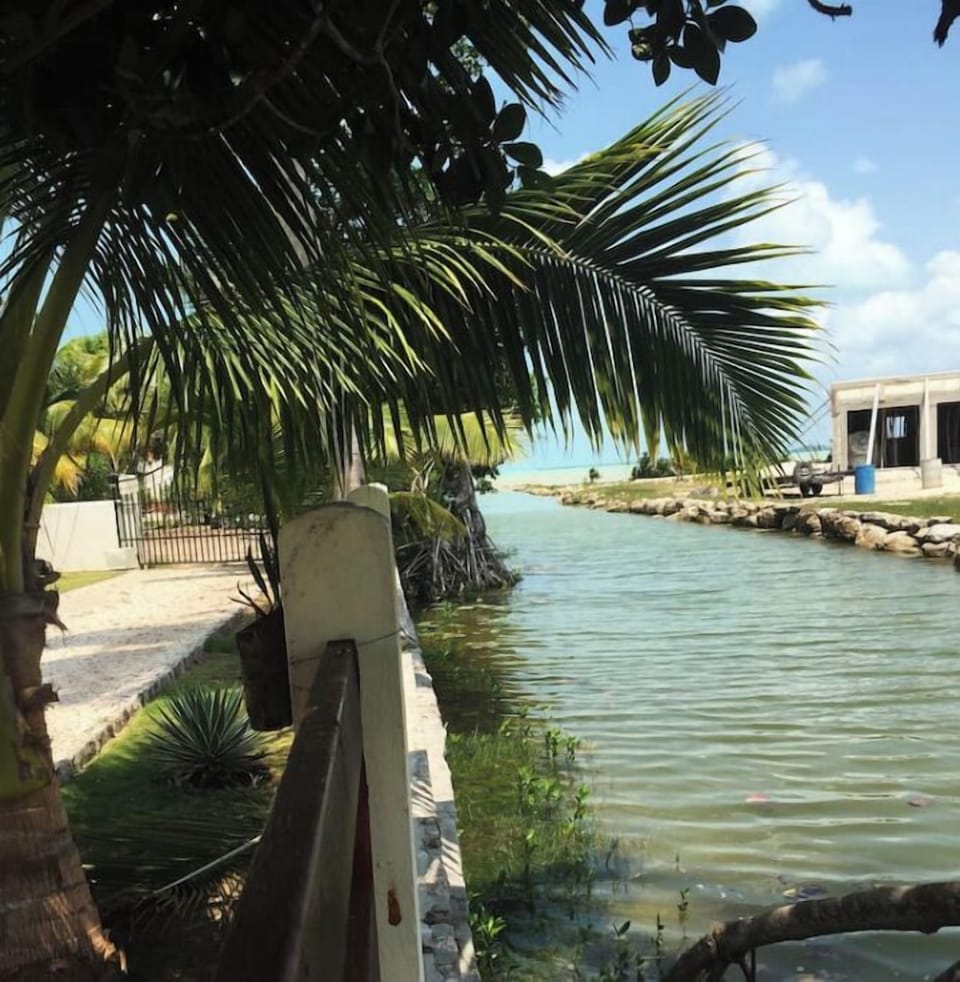 The canal opens to the sea, one house away.