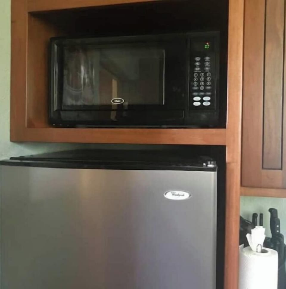 Microwave and double door fridge in Cottage.