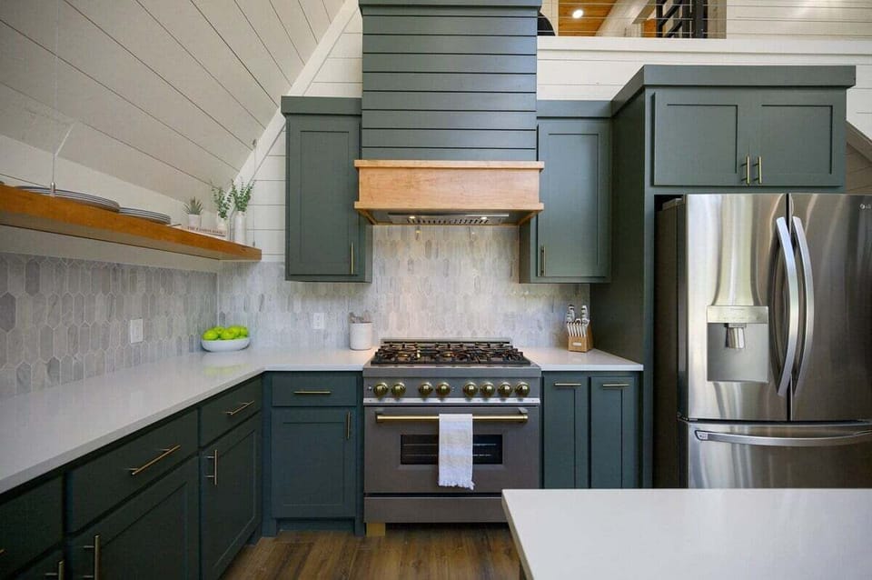 Gas stove top and full-size refrigerator and freezer