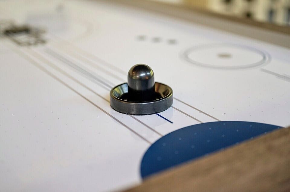 Air hockey table in upstairs game loft