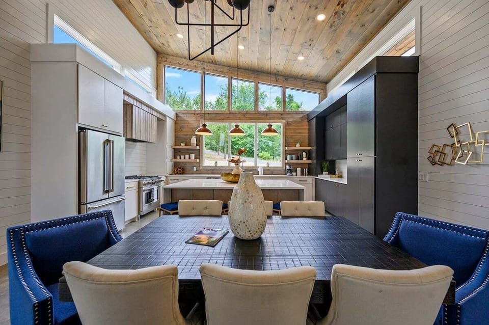 Dining table with seating for 8 and additional 4 at breakfast bar