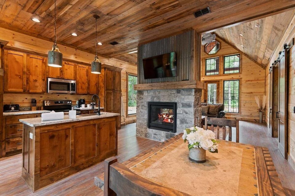 Double-sided fireplace serves the living and dining space