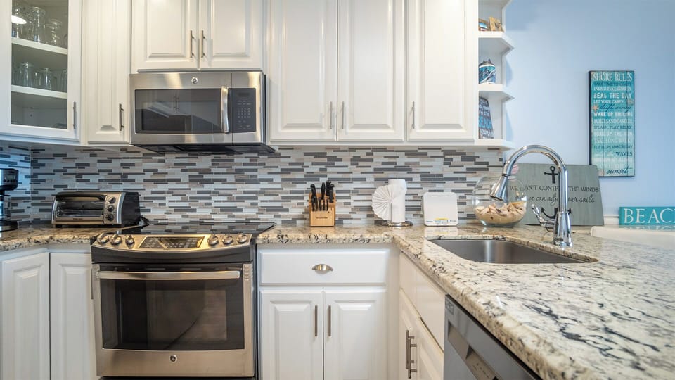 full kitchen with nice back splash