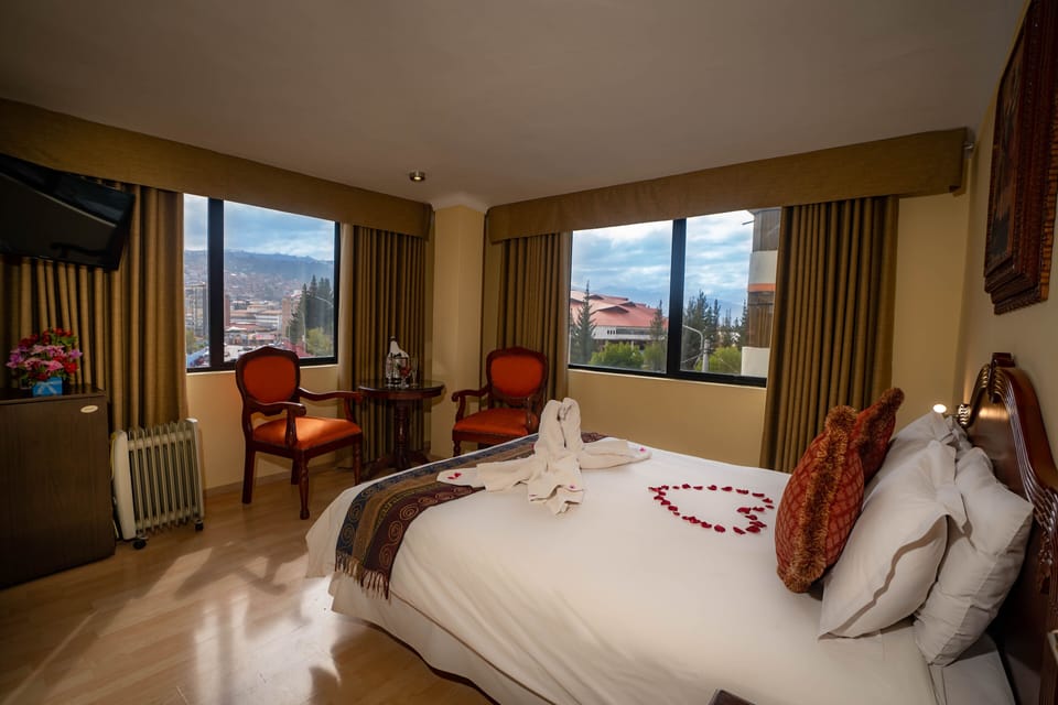 Double Room | Minibar, in-room safe, desk, blackout drapes