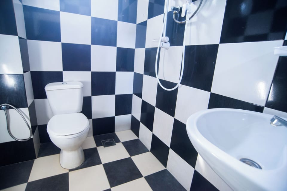 Basic Double Room, 1 Queen Bed | Bathroom | Shower, towels, soap, shampoo