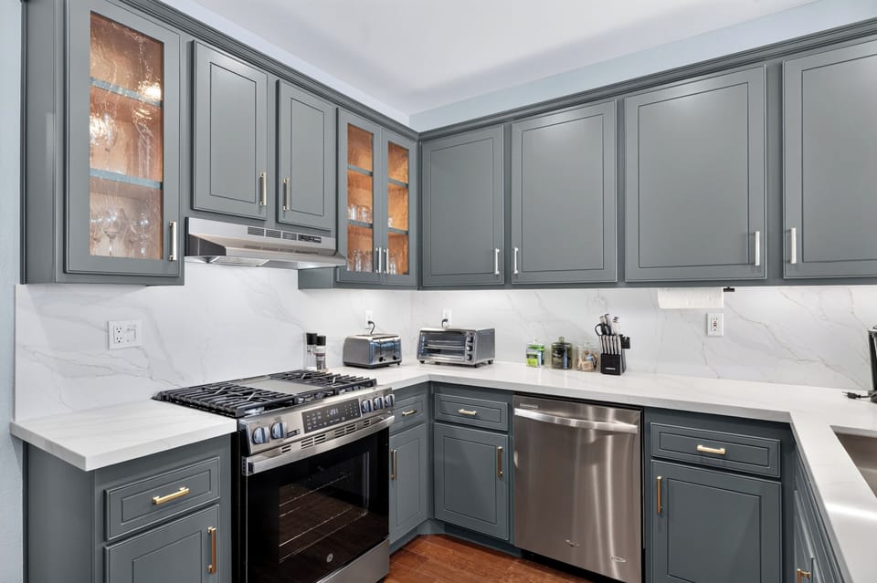 Kitchen is fully equipped and features stainless steel appliances.