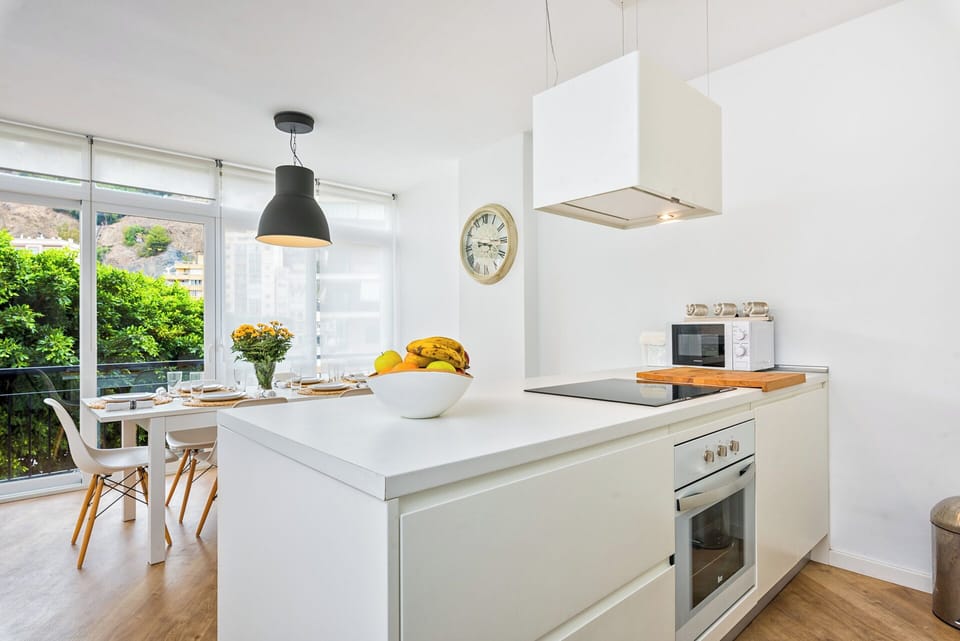 Family Apartment, City View | Living area | 50-inch flat-screen TV with cable channels
