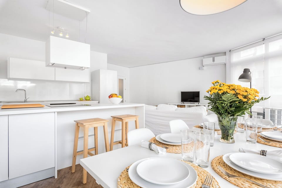 Family Apartment, City View | Living area | 50-inch flat-screen TV with cable channels