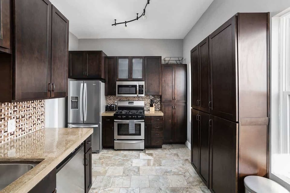 Kitchen is adorned with stainless steel appliances