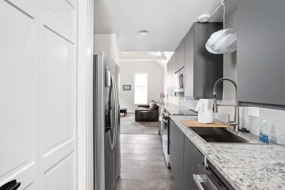 Enjoy full functionality in our pristine kitchen space, perfect for whipping up your favorite meals or brewing a morning cup of coffee.