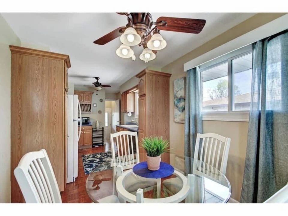 Enjoy your meal in this lovely dining table and chairs with ceiling fun and lots of natural lights.