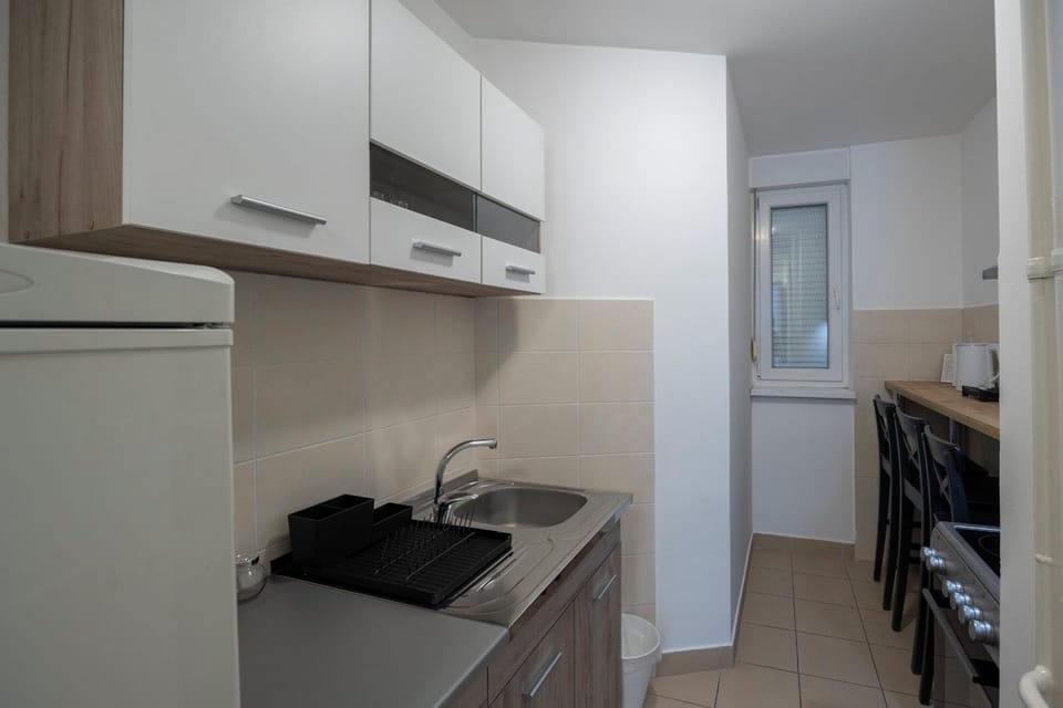 Family Apartment | Private kitchen | Full-size fridge, oven, stovetop, espresso maker