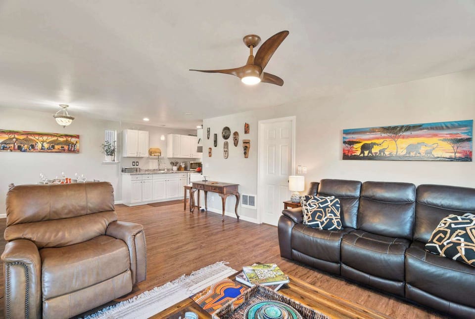 The open floor plan connects the living room to the dining room and kitchen, complete with a desk!