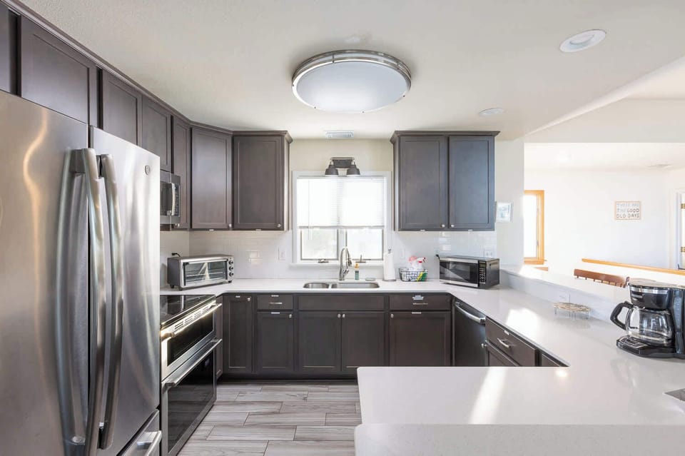 Top Level Updated Kitchen with New Appliances & Bar Seating