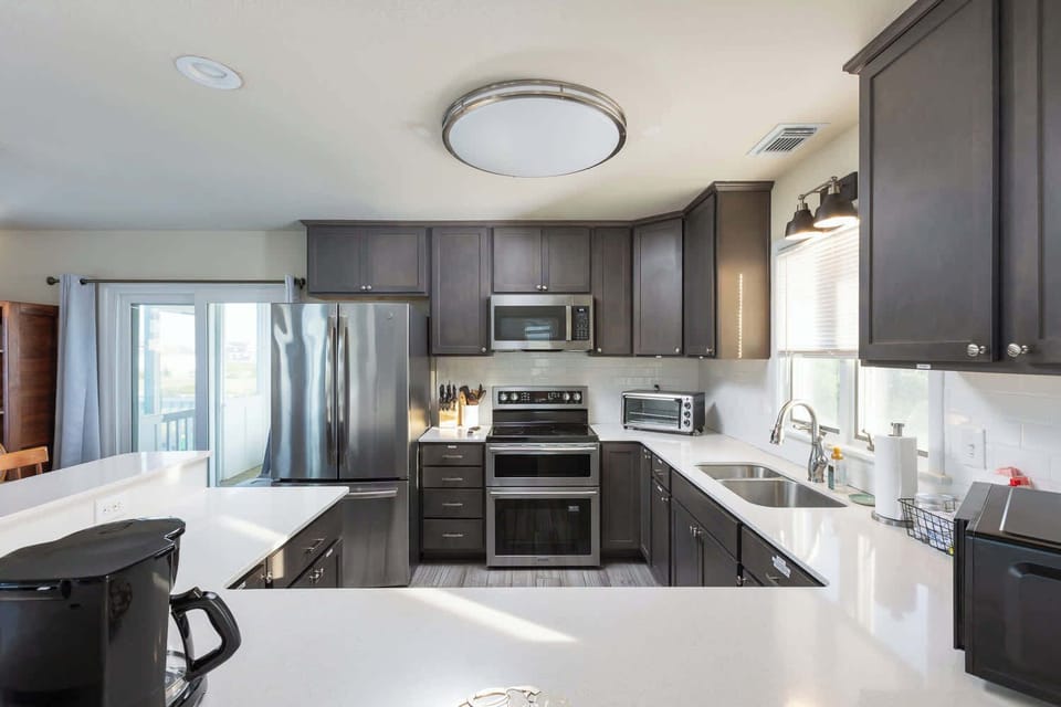 Top Level Updated Kitchen with New Appliances & Bar Seating