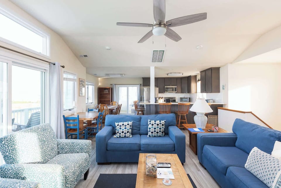 Top Level Living Area with Couch, TV & Sun Deck Access