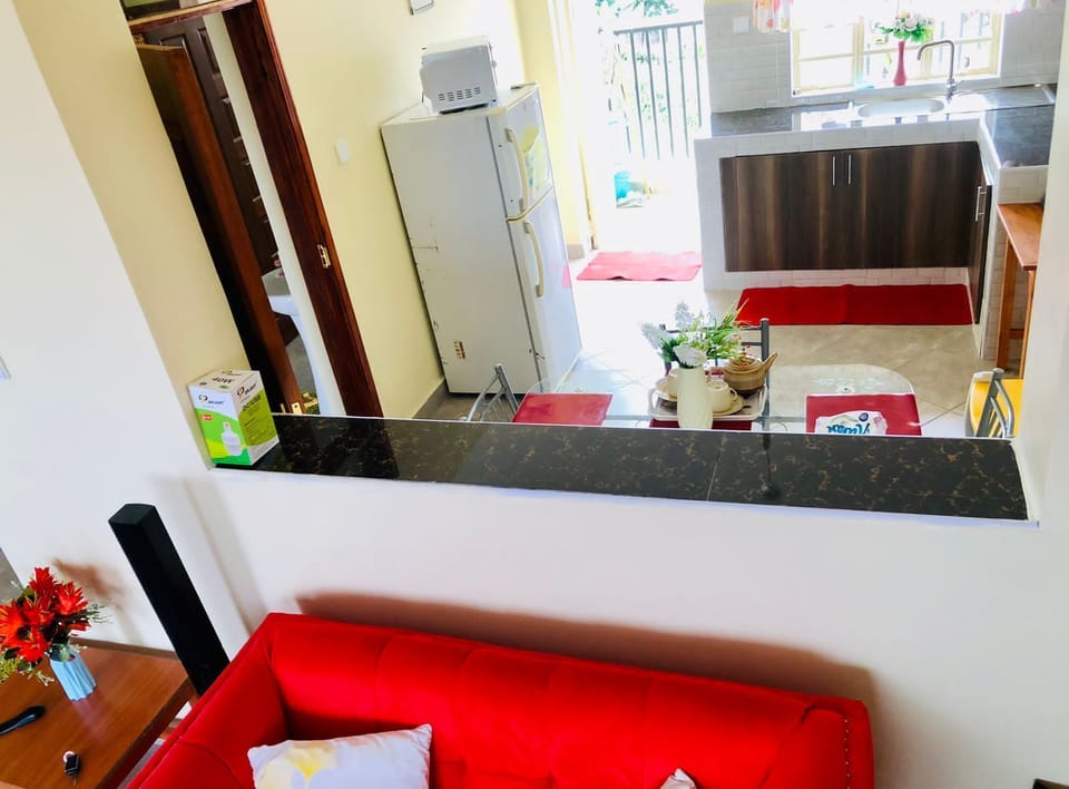 Comfort Apartment, Balcony, City View | Living area | 24-inch Smart TV with digital channels