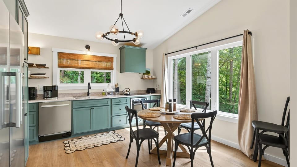 Large windows in the kitchen let in natural light